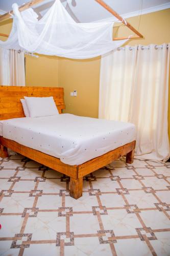 เตียงในห้องที่ Maili 6 Private Apartments