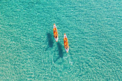 two boats in the water in the ocean at Sani Dunes in Sani Beach