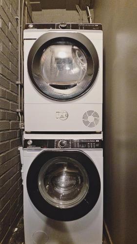 two washing machines stacked on top of each other at Kallhällsbaden Strandhotell in Stockholm