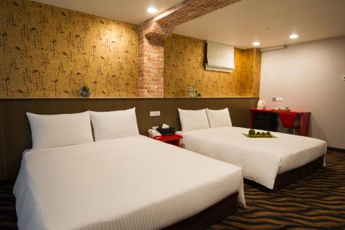Postel nebo postele na pokoji v ubytování Hotel 6 - ZhongHua
