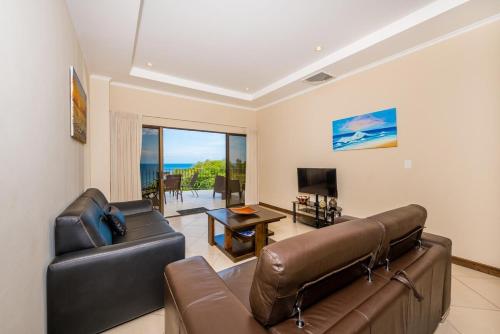 TV a/nebo společenská místnost v ubytování Ocean Views Beautiful Sunsets Pool