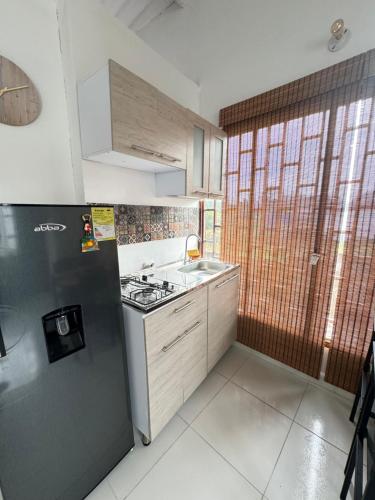 Kuchyň nebo kuchyňský kout v ubytování Apartamento Vacacional Campestre