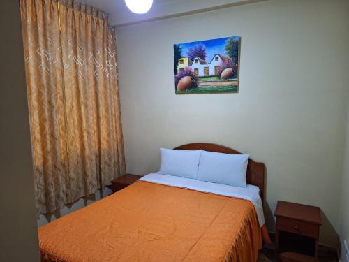 Katil atau katil-katil dalam bilik di Hostal El Tambo Tacna
