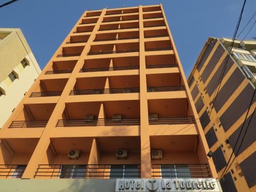 a tall building with balconies on the side of it at La Tourelle in Jounieh