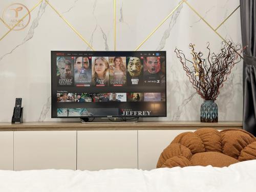 a flat screen tv sitting on top of a cabinet at Armin Homes Studio at Solforest Ecopark in HÆ°ng YÃªn