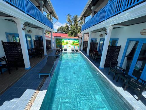 a swimming pool in the middle of a building at Sadakham Royal View Hotel in Luang Prabang