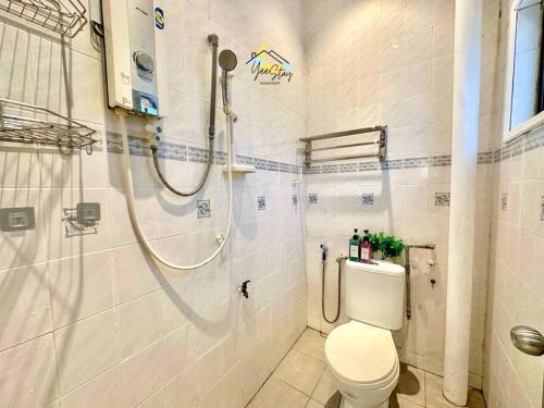 a bathroom with a shower and a toilet at 8pax3minsdrivetoJonkerTownArea in Melaka