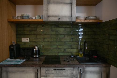 Kuchyň nebo kuchyňský kout v ubytování Apartmány Lúčny Raj