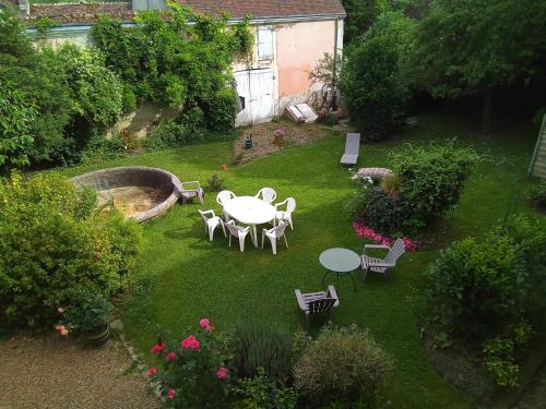 an aerial view of a garden with a table and chairs at L' Aphelide in Sablons-sur-Huisne