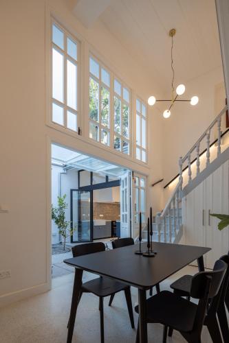 a dining room with a table and chairs at 1924 Gemini House Jacuzzi, Garden, Rooftop in Nicosia