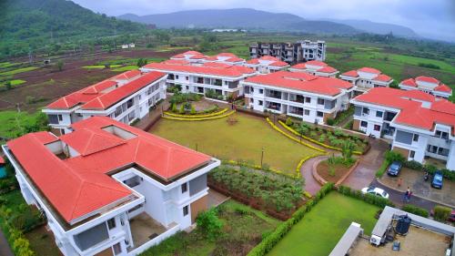 an aerial view of a building with red roofs at Mizzle Exotica Lonavala in Lonavala