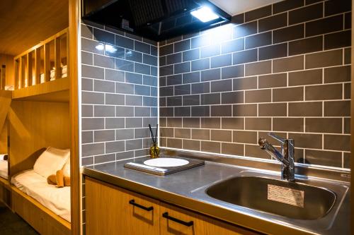 a kitchen with a sink in a room at THE BONDS HOTEL TOKYO in Tokyo