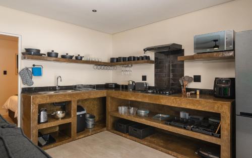 a kitchen with a sink and a counter top at Beach Wood Boutique Hotel & Resort in Ballito