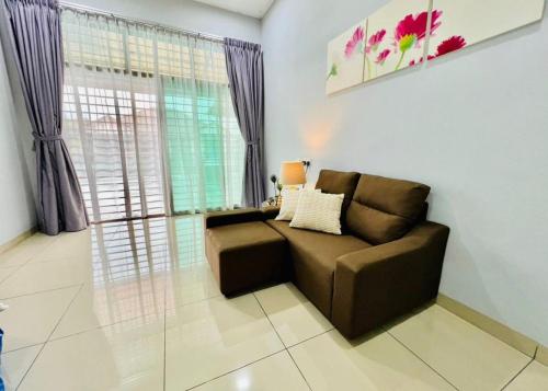 a living room with a couch and a window at ReGeoBP SemiD in Batu Pahat