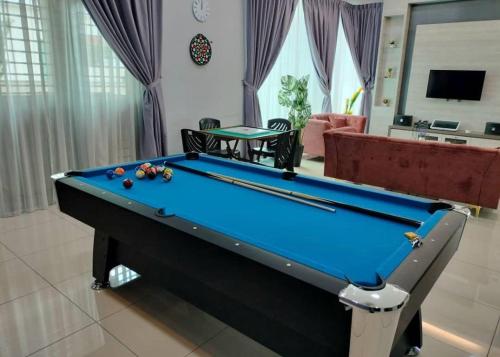 a pool table in the middle of a living room at ReGeoBP SemiD in Batu Pahat
