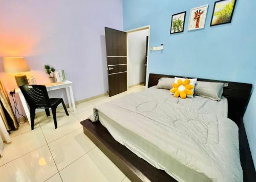 a bedroom with a bed with a flower on it at ReGeoBP SemiD in Batu Pahat