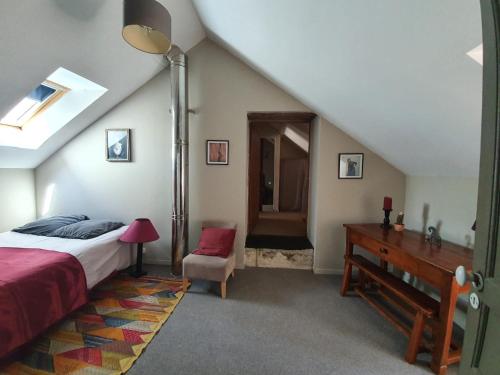 Ένα ή περισσότερα κρεβάτια σε δωμάτιο στο Maison de charme