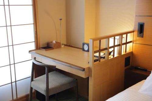 Ένα ή περισσότερα κρεβάτια σε δωμάτιο στο Hotel Niwa Tokyo