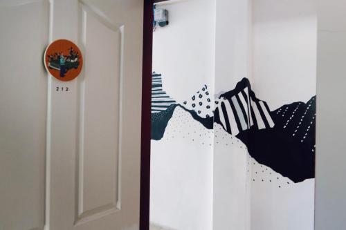 a door with an american flag painted on it at Puli Islet Inn in Puli