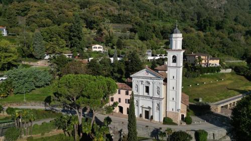 an aerial view of a church with a tower at Villetta Poesia in Morcote