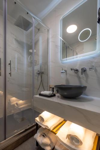 a bathroom with a sink and a glass shower at 507 Athens in Athens