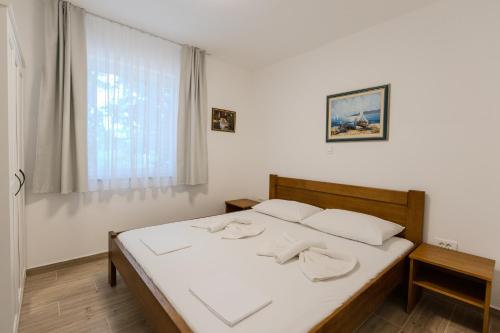 Postel nebo postele na pokoji v ubytování Apartments Lorena