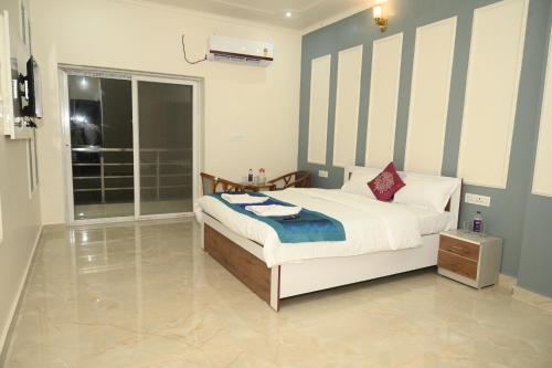 a bedroom with a large bed and a window at shangrila stay in Bodh Gaya