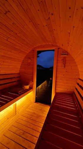 an inside of a sauna with a large window at Dębowy Domek Mazury in Szczybały Giżyckie