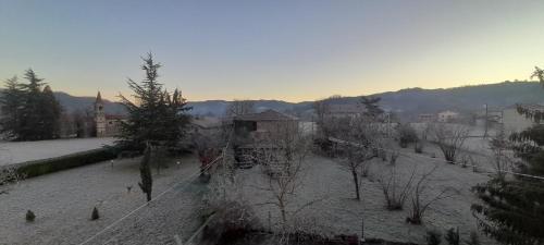 a view of a field with snow on the ground at Langhe di Liguria B&B in Piana Crixia