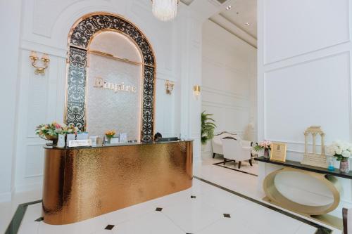 a dressing room with a mirror and a dressing table at The Empire Tower k in Jomtien Beach