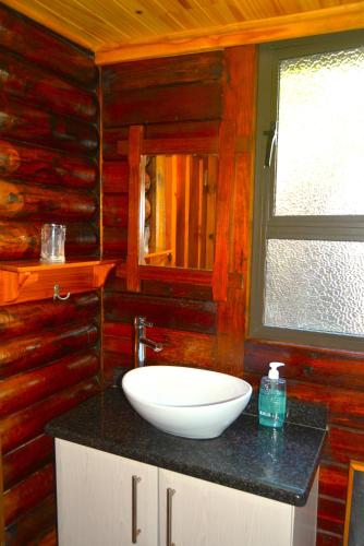 a bathroom with a white sink on a counter at Sodwana Bay Lodge House 34 in Sodwana Bay