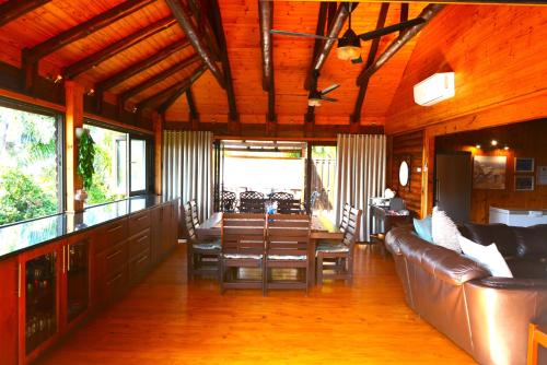 a living room with a couch and a table at Sodwana Bay Lodge House 34 in Sodwana Bay