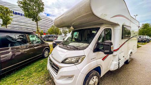a white truck parked in a parking lot at Hotel na kolech in Kladno