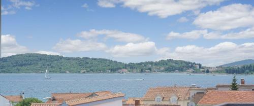 a view of a large body of water with houses at Hotel Stella Maris - Style & Comfort in Vodice