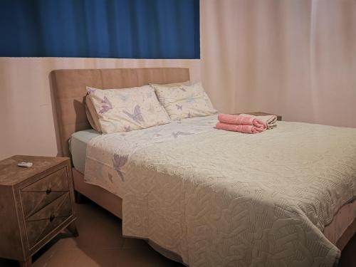 a bedroom with a bed with a nightstand and a bed sidx sidx at Xaido's House near airport port sea in Artemida