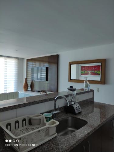 a kitchen with a sink and a counter top at Apartamento de tres habitaciones in Rodadero