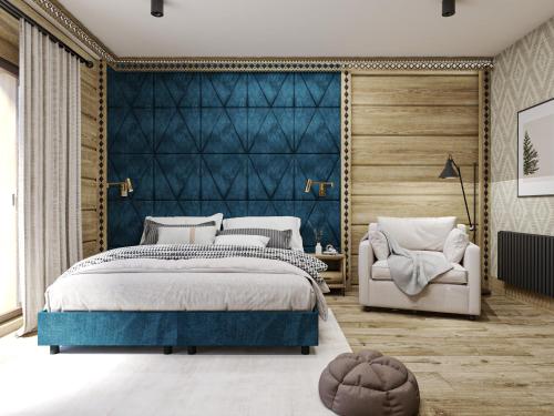 a bedroom with a bed with a blue headboard at Magdalenka 5 min pieszo od Kotelnicy in Białka Tatrzanska