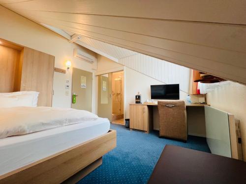 Postel nebo postele na pokoji v ubytování Hotel Felmis