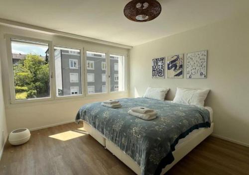 Ένα ή περισσότερα κρεβάτια σε δωμάτιο στο Moderne Wohnung in Zürich Oerlikon! -201-