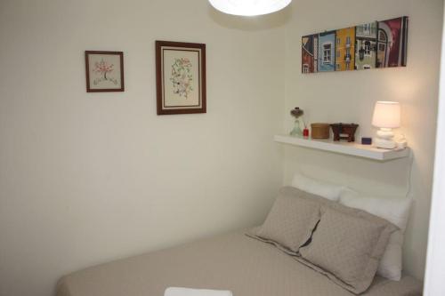 a room with a couch and two pictures on the wall at Sweet Alfama, Apartment 1 in Lisbon