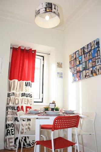 a room with a table and chairs and a window at Sweet Alfama, Apartment 1 in Lisbon