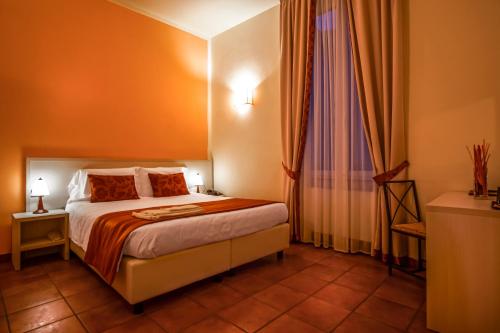 Postel nebo postele na pokoji v ubytování Hotel Bella Firenze