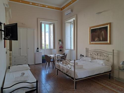 Posteľ alebo postele v izbe v ubytovaní Palazzo Castellano