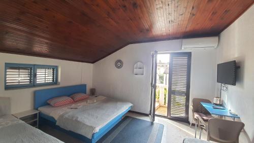 Una cama o camas en una habitación de Vojinovic Apartments
