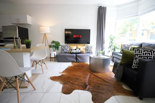 a living room with a couch and a table at 3 Bedroom 3 Bathroom Miami Beach Apartment in Miami Beach