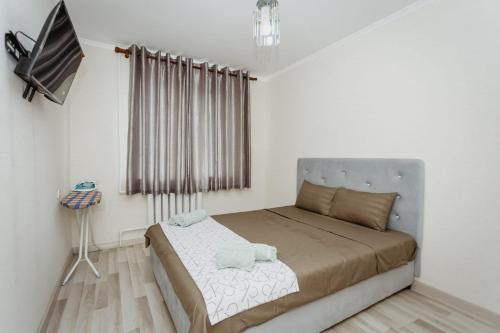 Llit o llits en una habitació de Квартира в центре