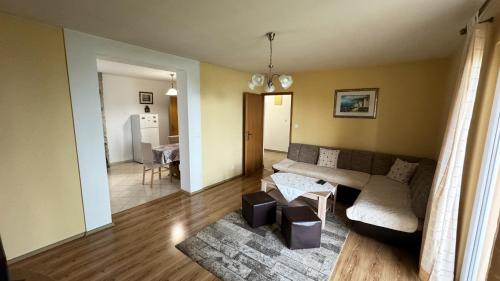 a living room with a couch and a table at Apartman Dani in Orebić