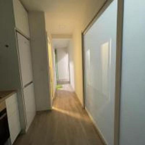 an empty hallway with a door in a room at MINATO Apartments Ostrava center in Ostrava
