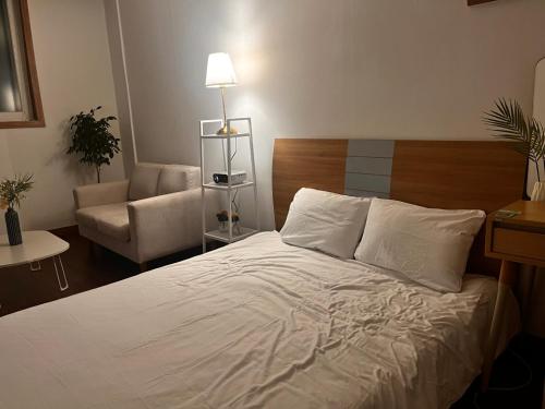 Ένα ή περισσότερα κρεβάτια σε δωμάτιο στο RGB Guesthouse
