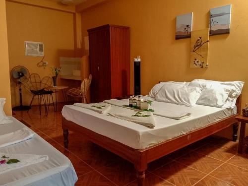 Postel nebo postele na pokoji v ubytování Moonlight Resort